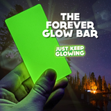 Bright green glow from the Forever Glow Bar against a dark night sky. Long-lasting, reusable light. Text overlay: Just Keep Glowing.