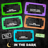 Variety of glowing license plate frames from Just Keep Glowing, showcasing different colors and glow effects in the dark. Highlighting US manufacturing and unique style for cars and motorcycles.