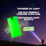 Forever Glow Bar: Eco-friendly, reusable, battery-free light. Glowing bright green against a starry night sky, charged by a flashlight beam. Text overlay: Powered by Light. Just Keep Glowing.