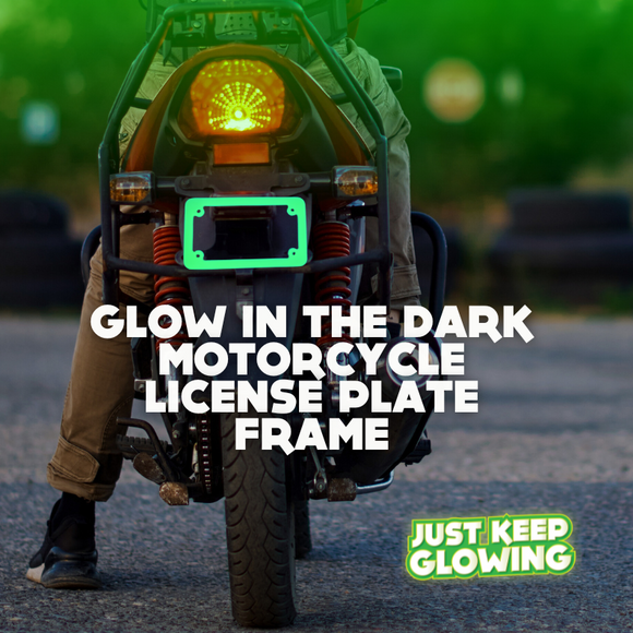 Green glow in the dark motorcycle license plate frame illuminating on a motorcycle at night, enhancing visibility and adding a unique style. Just Keep Glowing.